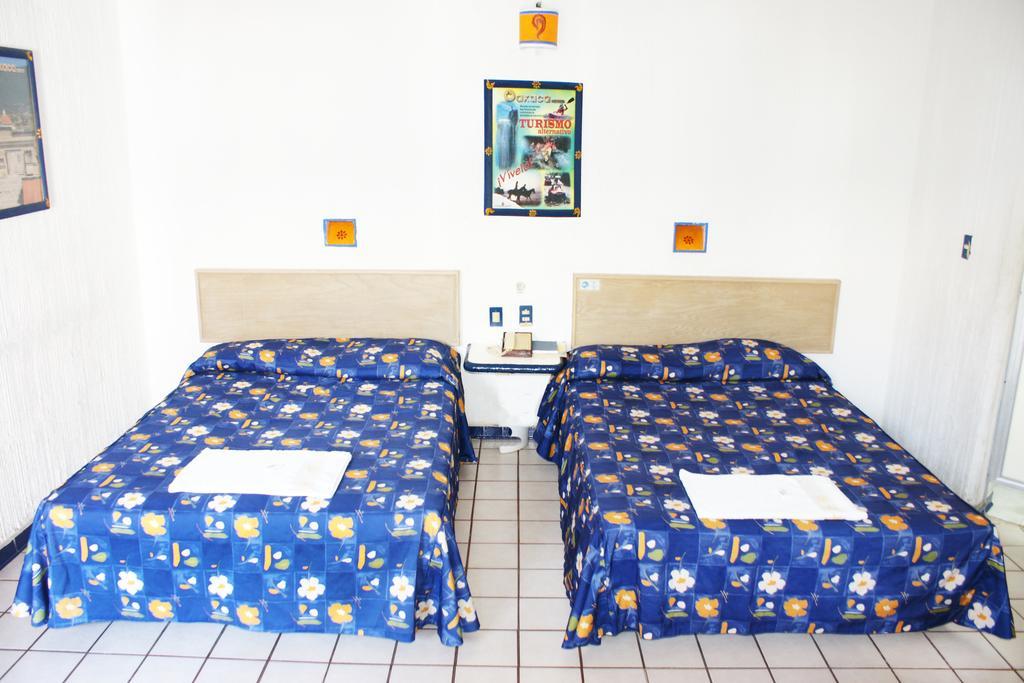 Hotel Plaza Conejo Huatulco Szoba fotó